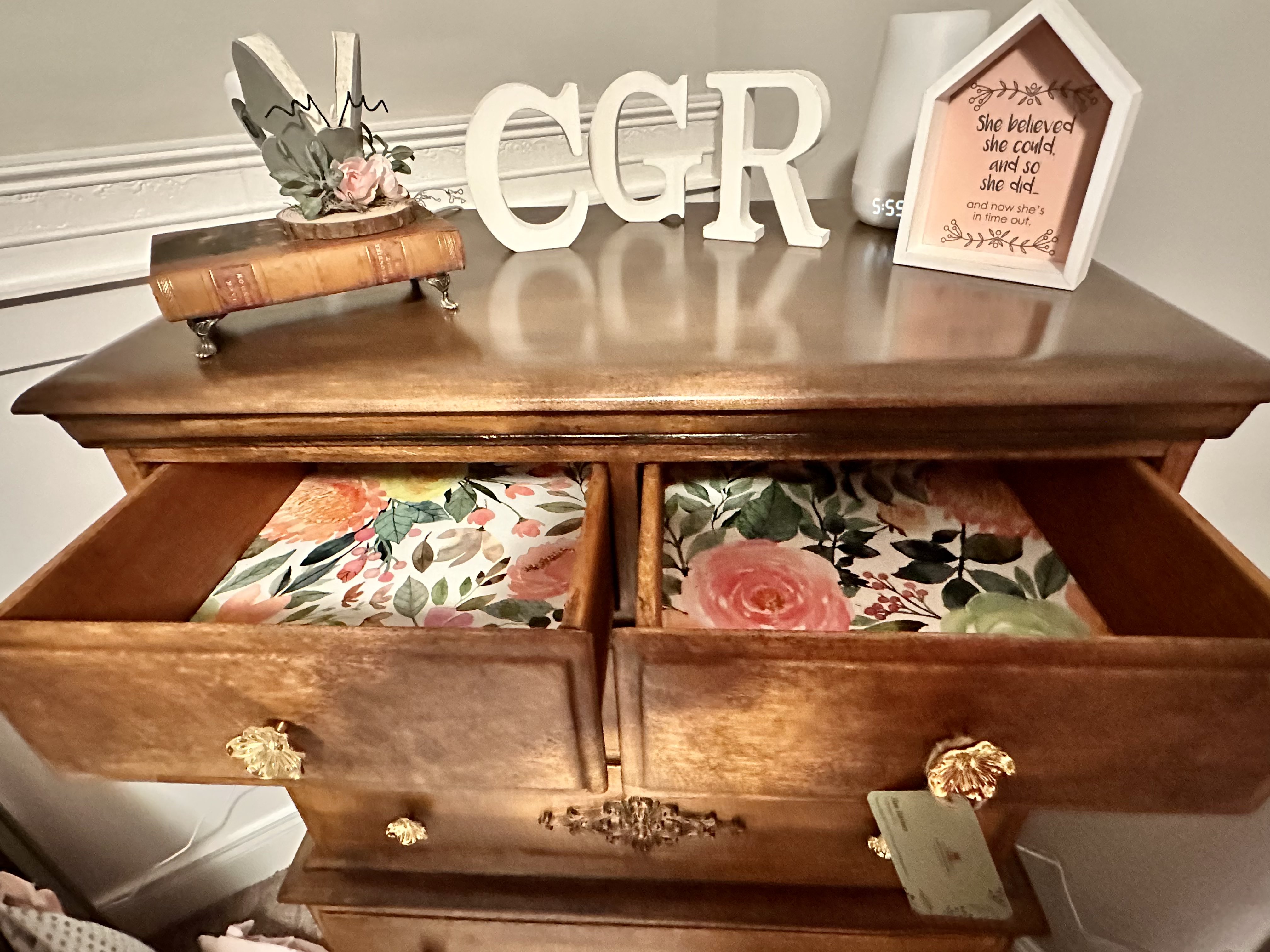 Open drawers lined with floral paper