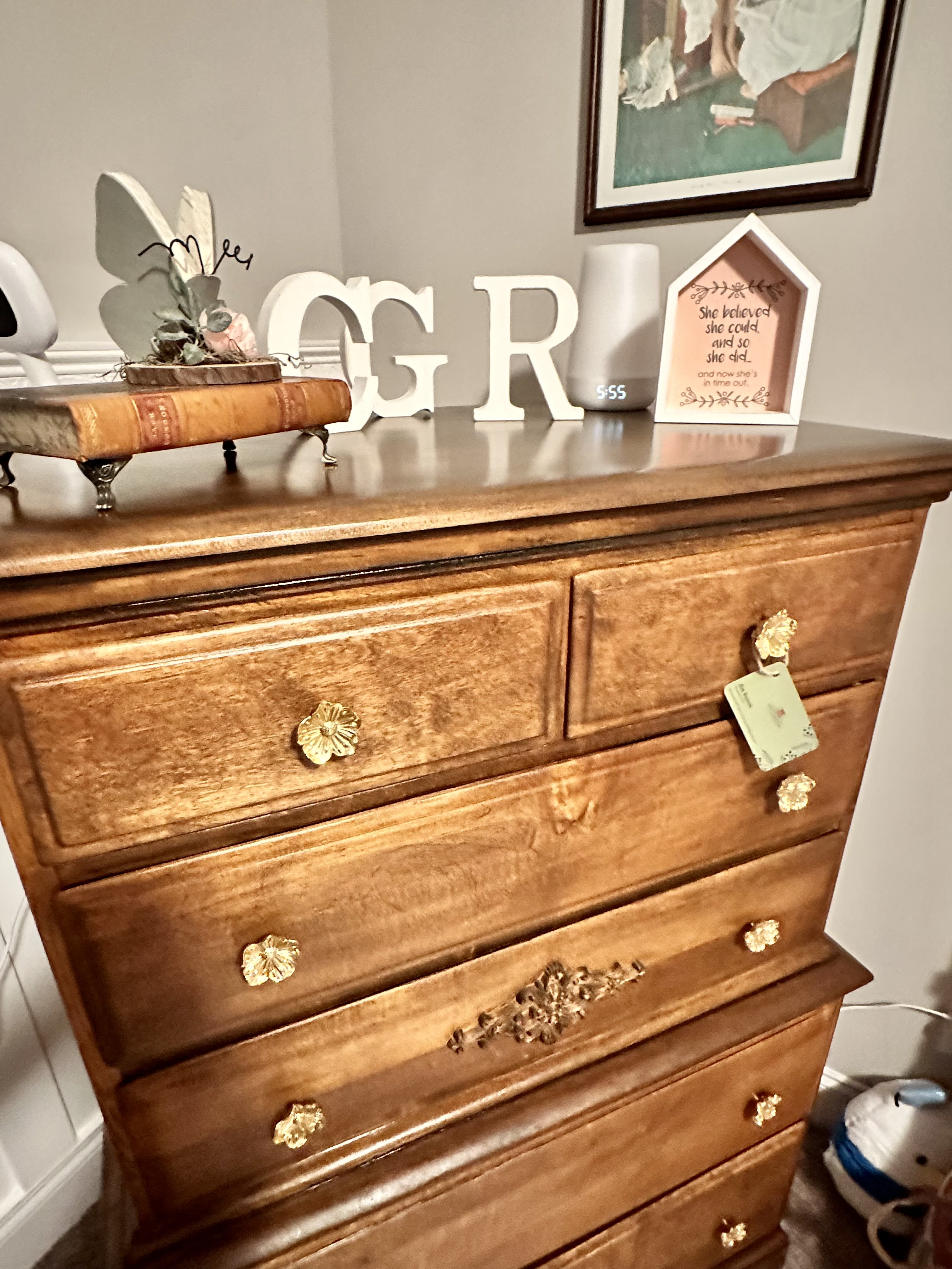 Detailed view of restored wood grain and brass pulls