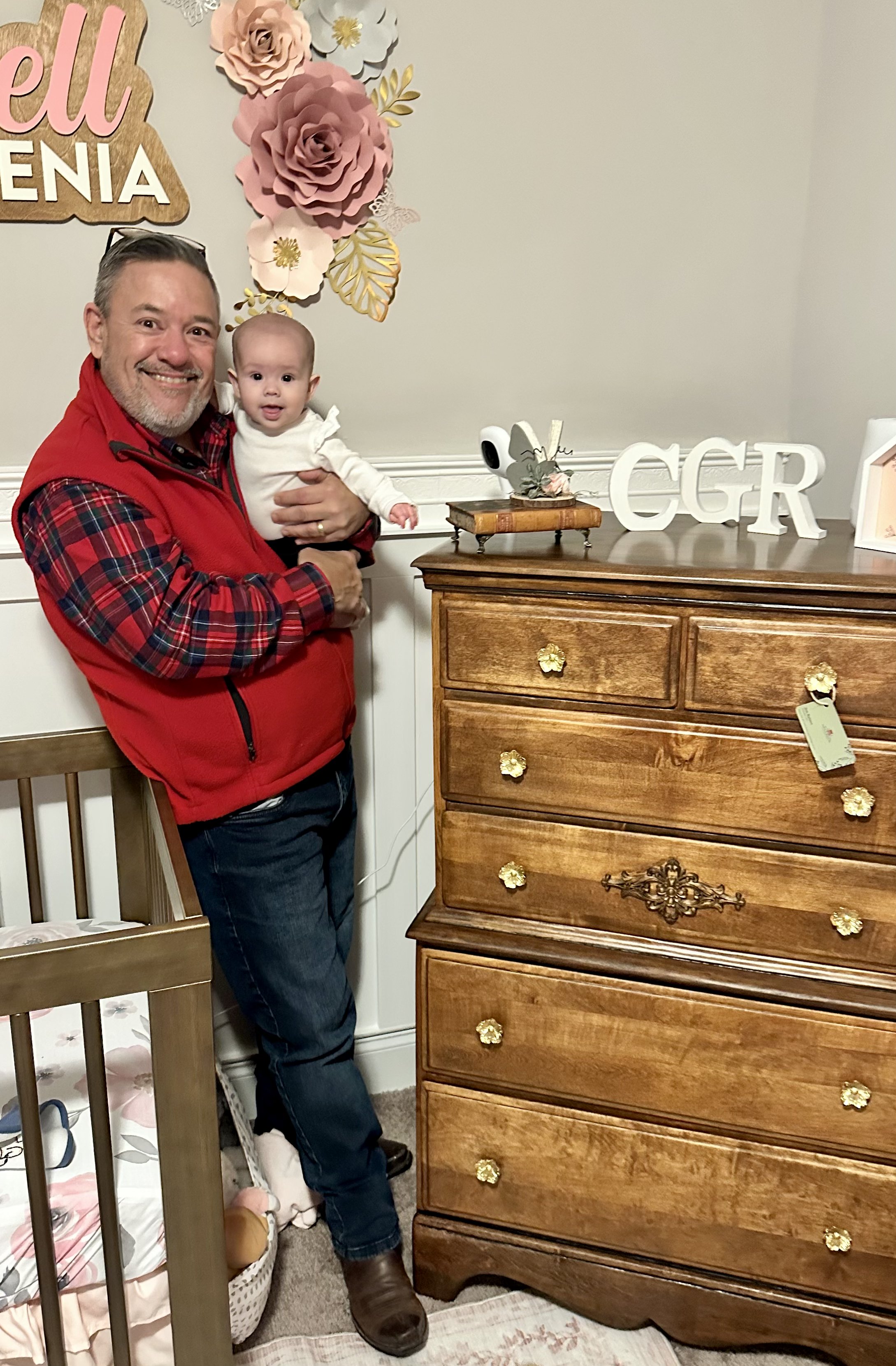 Pop with his granddaughter beside a restored chest